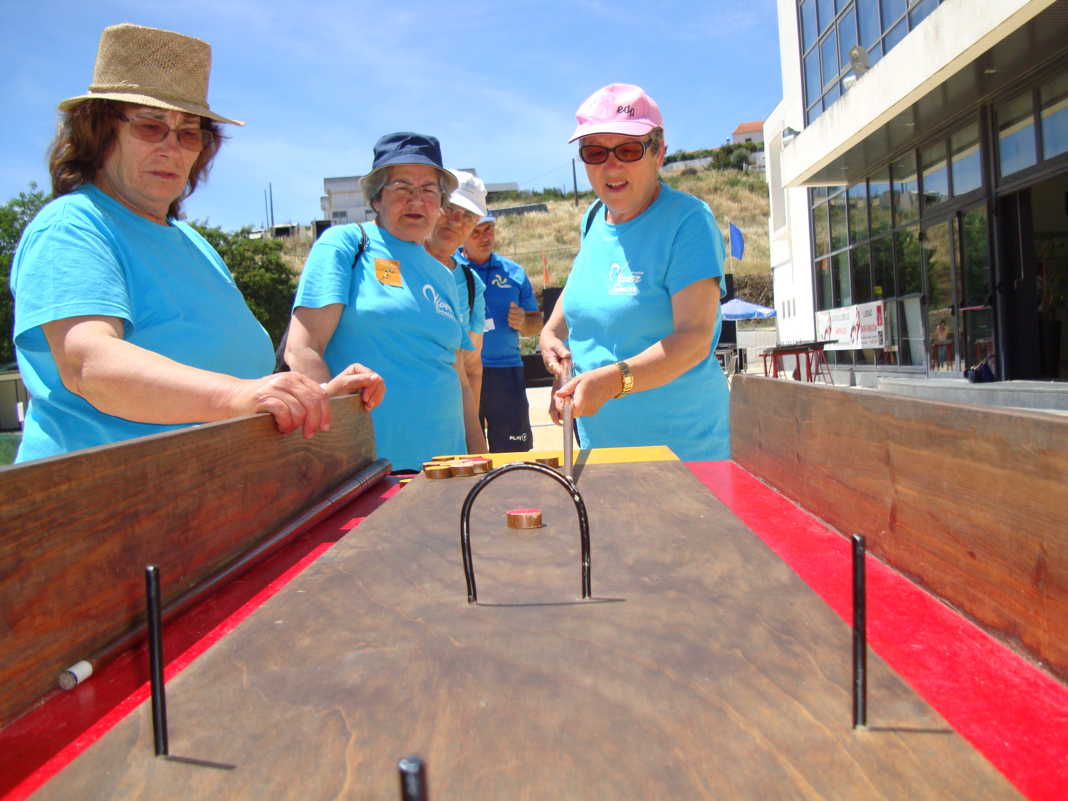 Portuguese women playing a kind of billiard game
