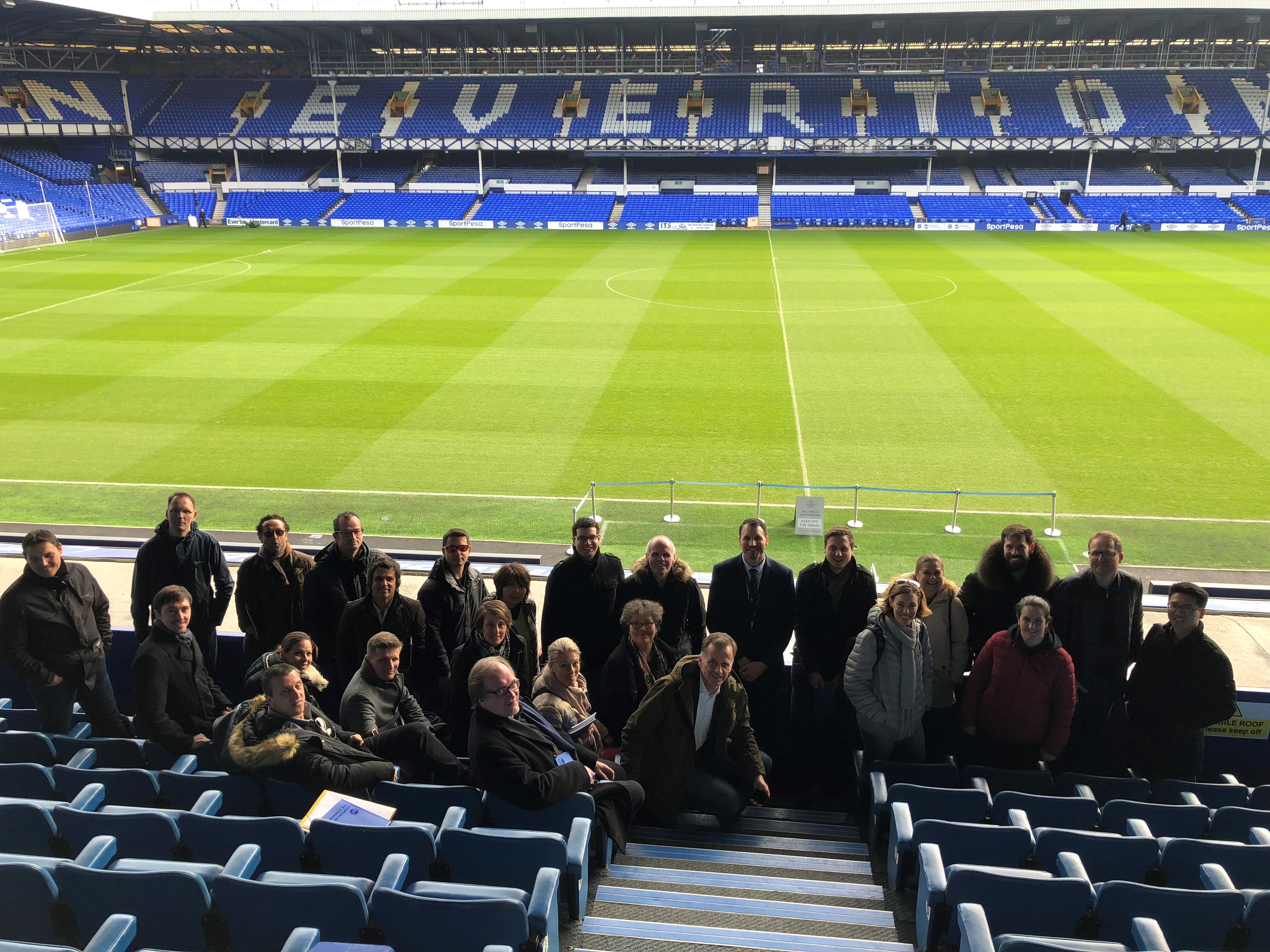 Workshop participants standing in the Everton stadium